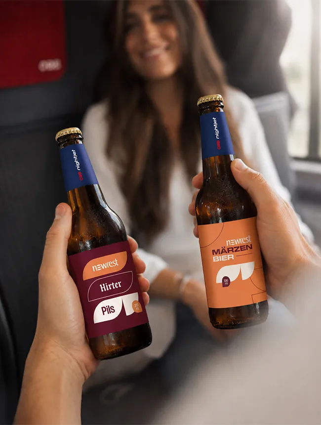 Newrest Bierflasche im Zug